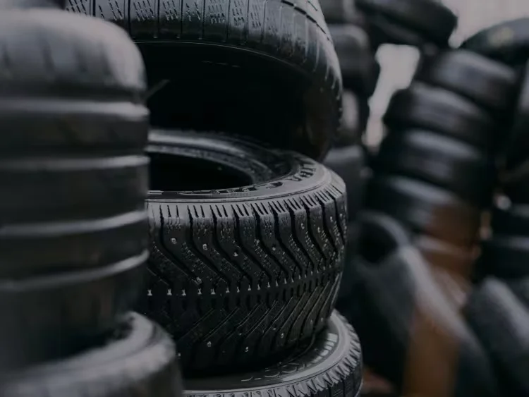 Collection of worn tyres prepared for tyre recycling and environmentally responsible disposal services
